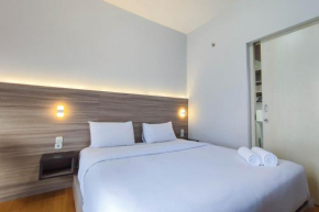 Comfort 1BR at Amartha View Apartment By Travelio